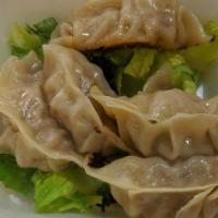 Pot Stckers (6) · Handmade steamed then pan fried dumpling filled with pork and cabbage.