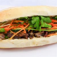 Bánh Mì / Sandwich · French toasted baguette, Includes:  Pickled Carrots & daikon, Cucumber, Cilantro, Jalapeño. ...