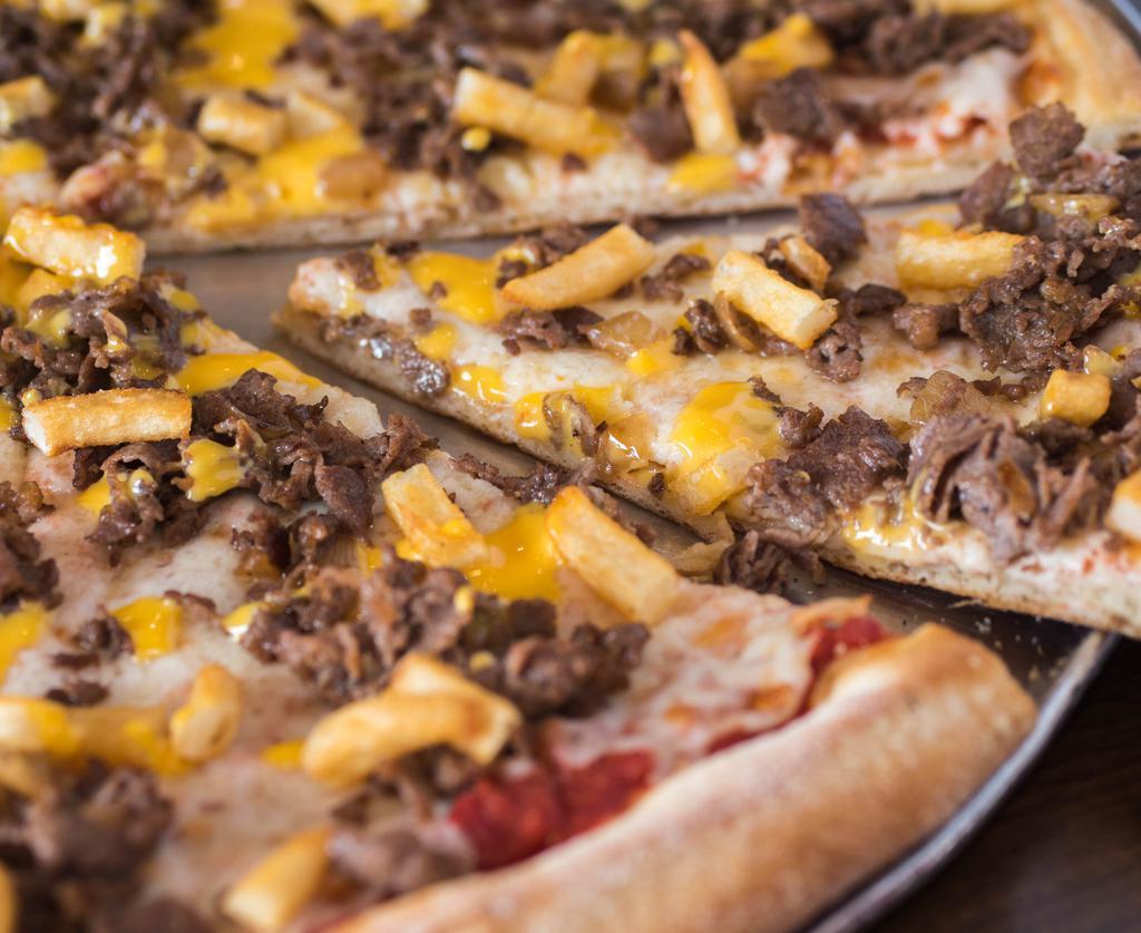 Cheese Steak Pie · Steak, French fries, grilled onions, red sauce, Mozzarella cheese & cheese whiz.