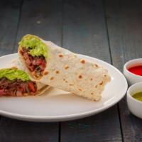 Rey Burrito · Carne asada, ham, bacon, pico de gallo, and guacamole.