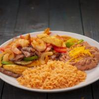 Mixed Fajitas Plate · Shrimp, steak, and chicken grilled with onion and bell pepper. Served with Rice & Beans.