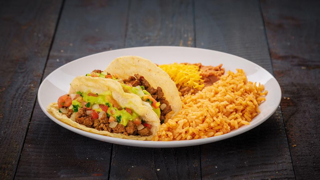 Two Carne Asada Tacos · Two carne asada tacos. Served with rice and beans.