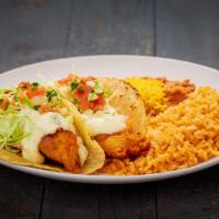 Two Fish Tacos · Two battered fish tacos. Served with rice and beans.