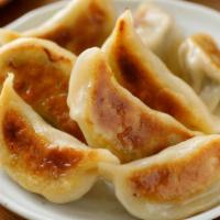 Potstickers (7) · 7 vegetable dumplings with dipping sauce .