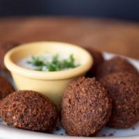 Falafel · 6 fried chickpea patties mixed with parsley, cilantro, onions, garlic and house spices. Serv...