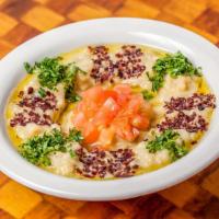 Baba Ghanouj · A smoky roasted eggplant dip with tahini, garlic, lemon juice and olive oil. Served with two...