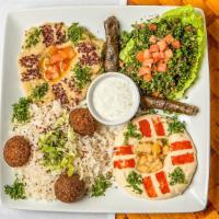 Vegetarian Combo · Falafel, hummus, Baba ghanouj, tabbouleh salad and stuffed grape leaves. Served with basmati...