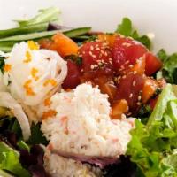 Big Island Poke · Bed of fresh salad mix,tuna and salmon, tossed in our spicy poke sauce,kani salad,tobiko, an...