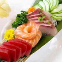 Sashimi Trio · 5 pcs Salmon, 5 pcs Tuna, 5 pcs Yellowtail.