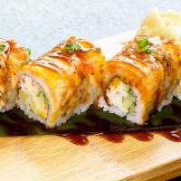 Orenji Dragon · Inside: shrimp tempura, cucumber, krab. Top: seared salmon with spicy aioli, tobiko, unagi s...