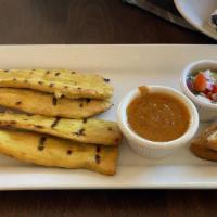 Chicken Satay · Marinated in coconut milk & curry served with fresh cucumber vinaigrette & peanut sauce. Eac...