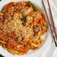 Burmese Noodles · Stir-fried wide noodles with fresh vegetables, egg in a rich blend of creamy peanut sauce & ...