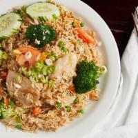 Thai Fried Rice · Wok-fried jasmine rice with tomatoes, egg, onion, carrots, broccoli & served with fresh cucu...