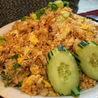 Crab Fried Rice · wok fried rice with crab meat, eggs,tomatoes, onions, peas, broccoli 
cucumber .
