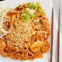 Singapore Noodles · Stir-fried vermicelli noodles with eggs, mixed vegetables, yellow curry paste and house sauce.