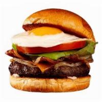 Breakfast Burger · Beef patty, bacon, caramelized onions, melted cheddar cheese, mayo, and a fried egg on a bri...