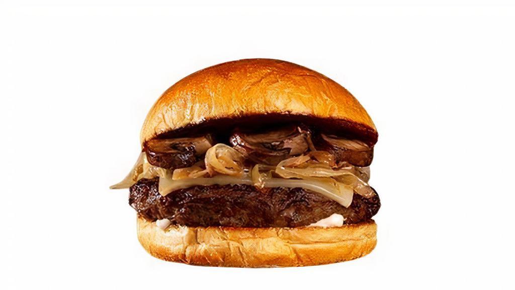 Mushroom Swiss Cheeseburger · Beef patty, roasted mushrooms, caramelized onions, melted swiss cheese, and mayo on a brioche bun.