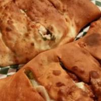Vegetariano Calzone · Green peppers, black olives, mushrooms & onions.