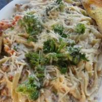 Vegetarian Pasta · Spaghetti, butter, onions, mushrooms, garlic, broccoli & feta cheese.