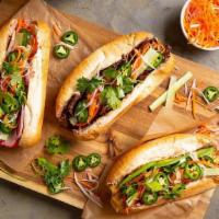 Banh Mi Sandwiches · Warm, toasted baguette with choice of protein, pate, cucumber, pickled daikon-carrot, cilant...