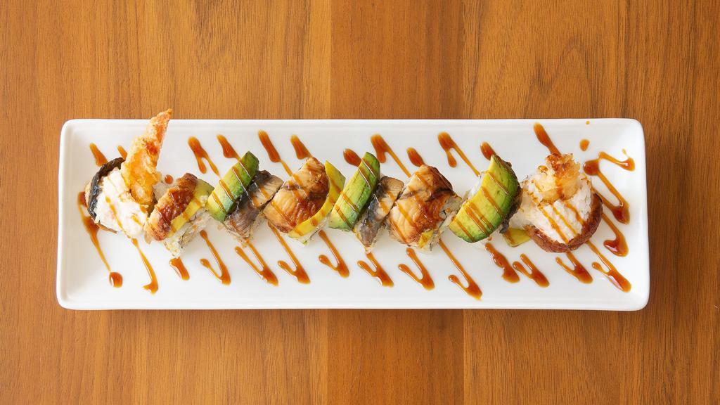 Dragon Roll · 8 pieces. Tempura shrimp, crab and cucumber topped with unagi, avocado.