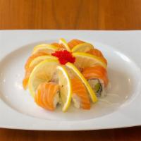 Aspen Roll · Eight pieces. Crab and avocado, cucumber topped with salmon, lemon.