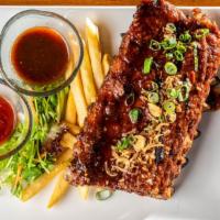 Baby Back Rib · Marinated with spicy tamarind BBQ sauce. Thai sweet BBQ sauce. Served with French fries.