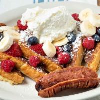 Mom'S French Toast · Sliced challah bread dipped in our egg batter. Topped with raspberries, strawberries, fresh ...