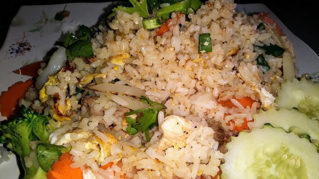 Thai Fried Rice · Jasmine rice, egg, onion, tomato, carrots, and green onion.