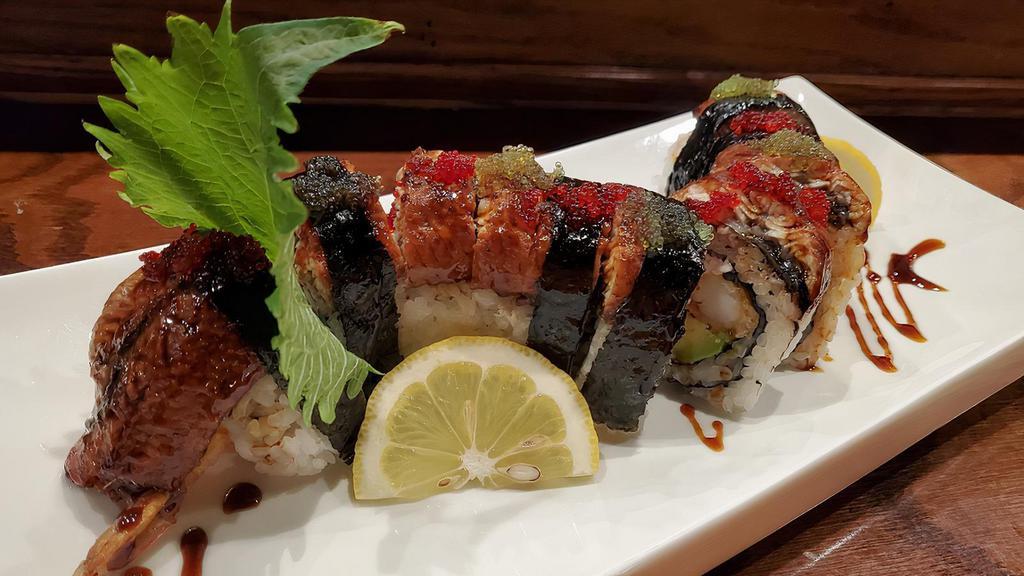 Dragon · California with shrimp tempura, topped with whole unagi.