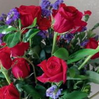 For The Special Someone · A beautiful arrangement adding to the vase 18 red roses mix colorful foliage. Perfect for th...