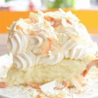 Triple Coconut Cream Pie Slice · Coconut Crust, Coconut Pastry Cream, Toasted Coconut and White Chocolate Shavings