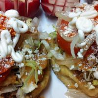 Sopes · Sopes with beans and your choice of meat topped with lettuce, pico de gallo, sour cream, and...