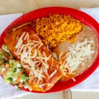 Enchilada Style Burrito Combo · One enchilada style burrito with beans, cheese, and your choice of meat. Served alongside ri...