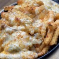 Green Chile Cheese Fries · French fries, traditional pork or vegetarian green chile, Cheddar, and Jack.