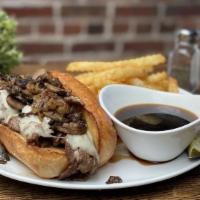 Prime Rib French Dip · Shaved, roasted prime rib, au jus, and a hoagie roll. Served with your choice of side.