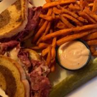 Reuben · Corned beef, Swiss, sauerkraut, marble rye, and Russian dressing. Served with your choice of...