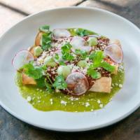 Enchiladas · Black beans, cheddar, house-made tomatillo & mole sauces, avocado crema, feta & cilantro