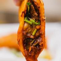 Birria Taco · Soft corn tortillas dipped in our signature Drip© broth, birria meat, and grilled to perfect...