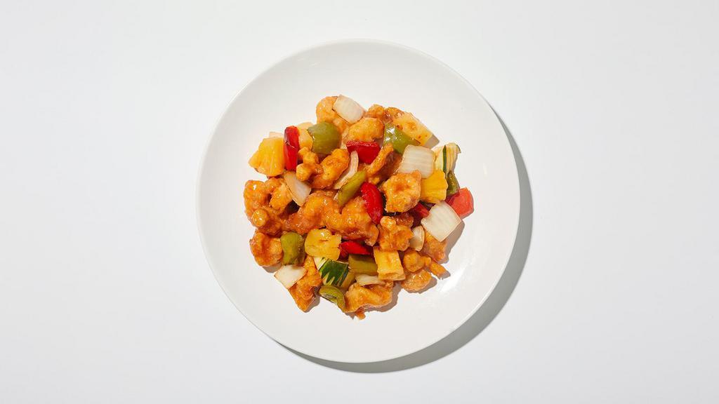Sweet And Sour Chicken · Battered chicken covered with sweet and sour sauce, pineapple, carrots, bell pepper, and white onions.