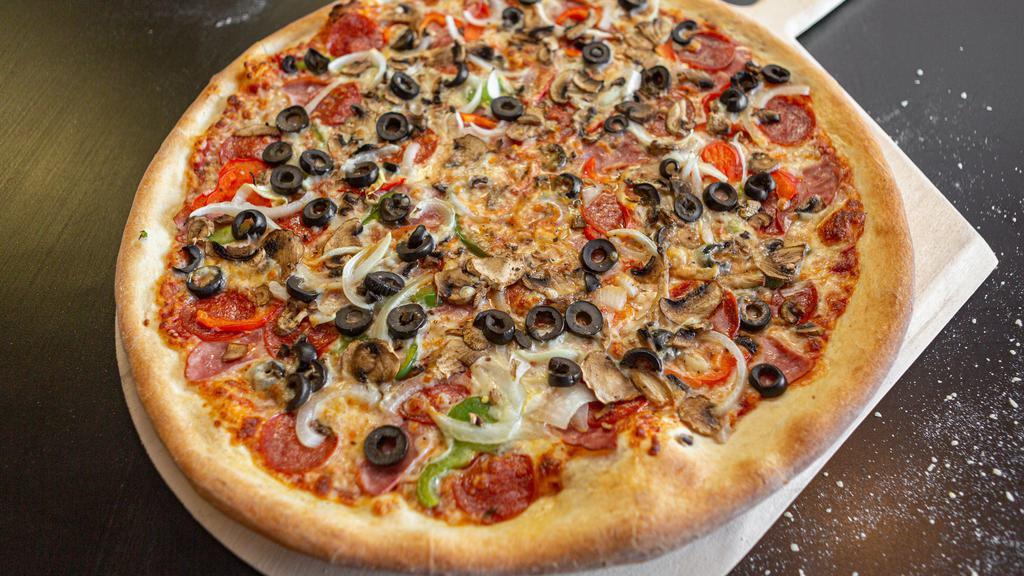 Super Combo Pizza · Mushrooms, Pepperoni, Canadian Bacon, Onion, Green Peppers, Black Olives and Extra Cheese.