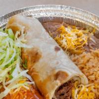 Shredder Beef Burrito And Enchilada  · Served with rice and beans.