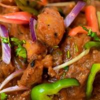 Dhaba Chicken Curry · Tandoor smoked chicken simmered in a dhaba style curry served with naan