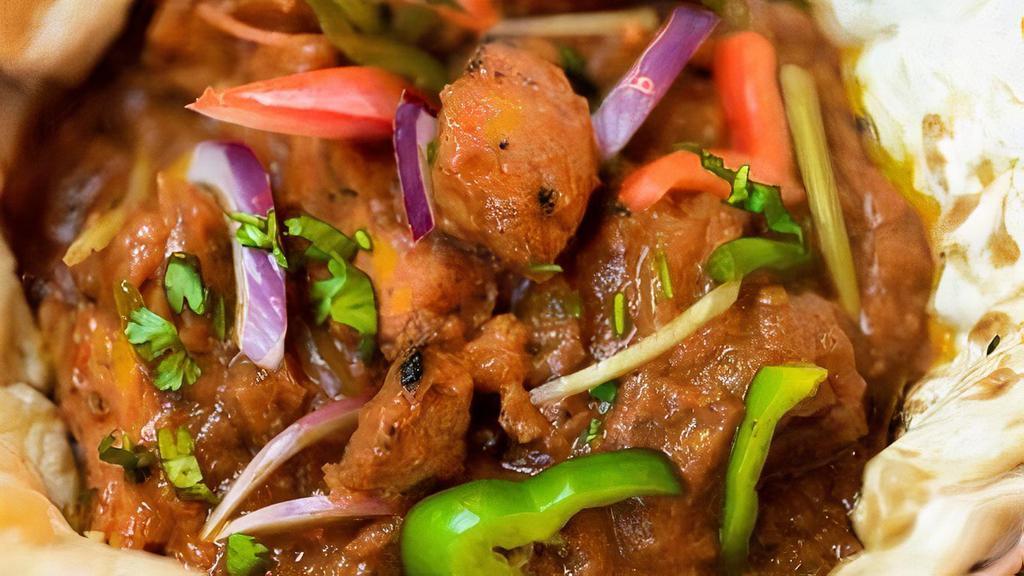 Dhaba Chicken Curry · Tandoor smoked chicken simmered in a dhaba style curry served with naan