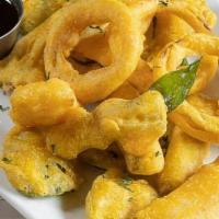 Assorted Pakoras · (VEG) Seasonal vegetables dredged in a spiced chickpea batter, golden fried and served with ...