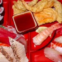 Sashimi Dinner Box · Sashimi sampler, sushi sampler, shrimp and vegetable tempura, and seaweed salad into one box.