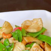 Royal Chicken · Sliced chicken breast, snow peas, bell peppers and cashews in a house garlic sauce.