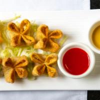 Spinach Cheese Wontons (6) · Extra-crispy wontons filled with crab meat, plus fresh spinach in a cream cheese base.