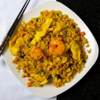 Tropical Fried Rice · Combination of shrimp and chicken stir fried with white rice, pineapple, eggs, cashews and r...