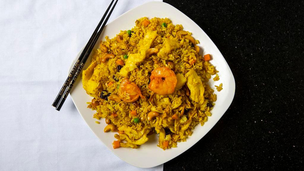 Tropical Fried Rice · Combination of shrimp and chicken stir fried with white rice, pineapple, eggs, cashews and raisins in spicy curry.